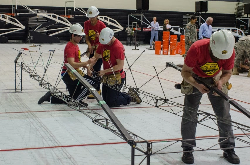 École Polytechnique Montréal Steel Bridge Team, sponsored by MAADI Group, standing with their steel bridge project. Photo credit: ArcelorMittal Montreal.