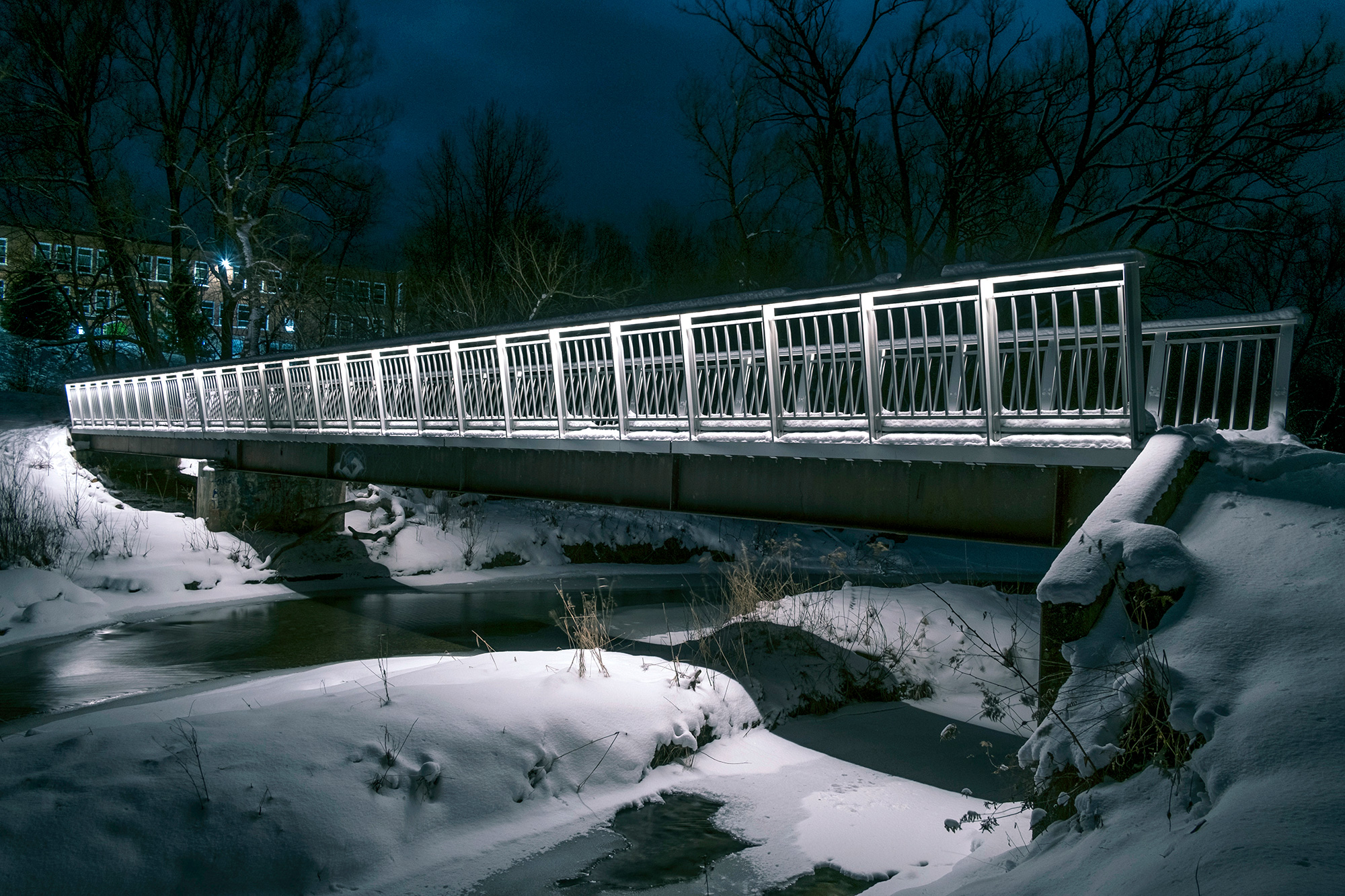 Pedestrian bridge with weld-free aluminum decking over frozen lake