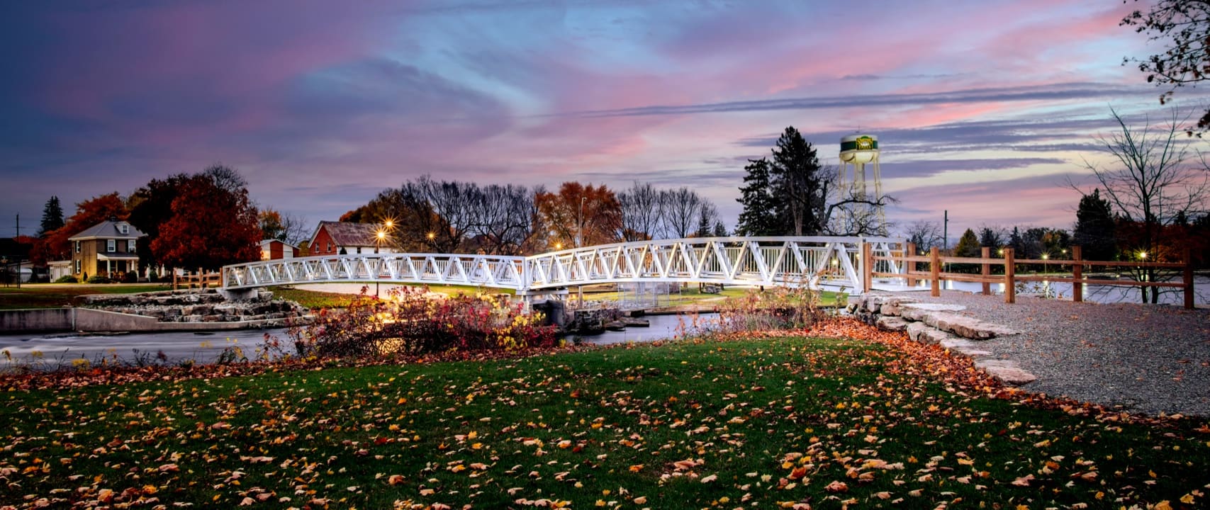 Aluminum pedestrian bridge in autumn evening in Ontario