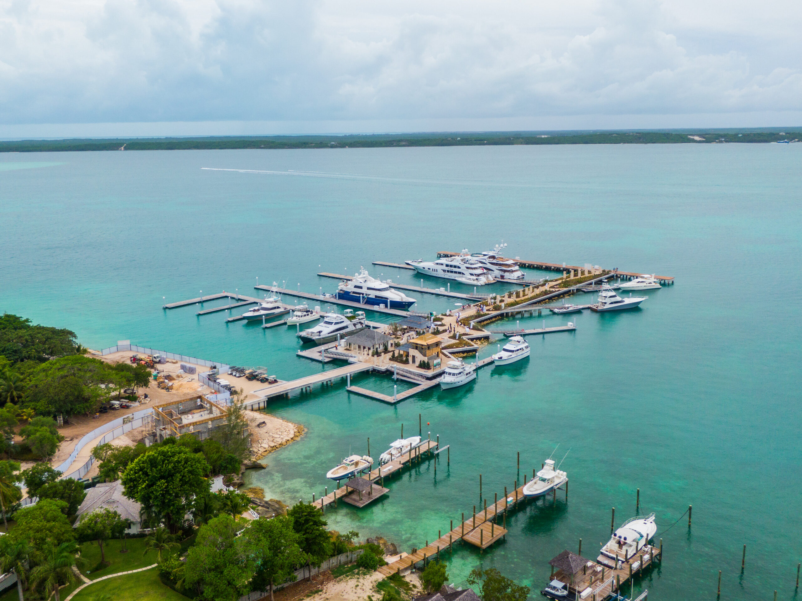 Aluminum marina with large yachts moored in turquoise sea in the Bahamas
