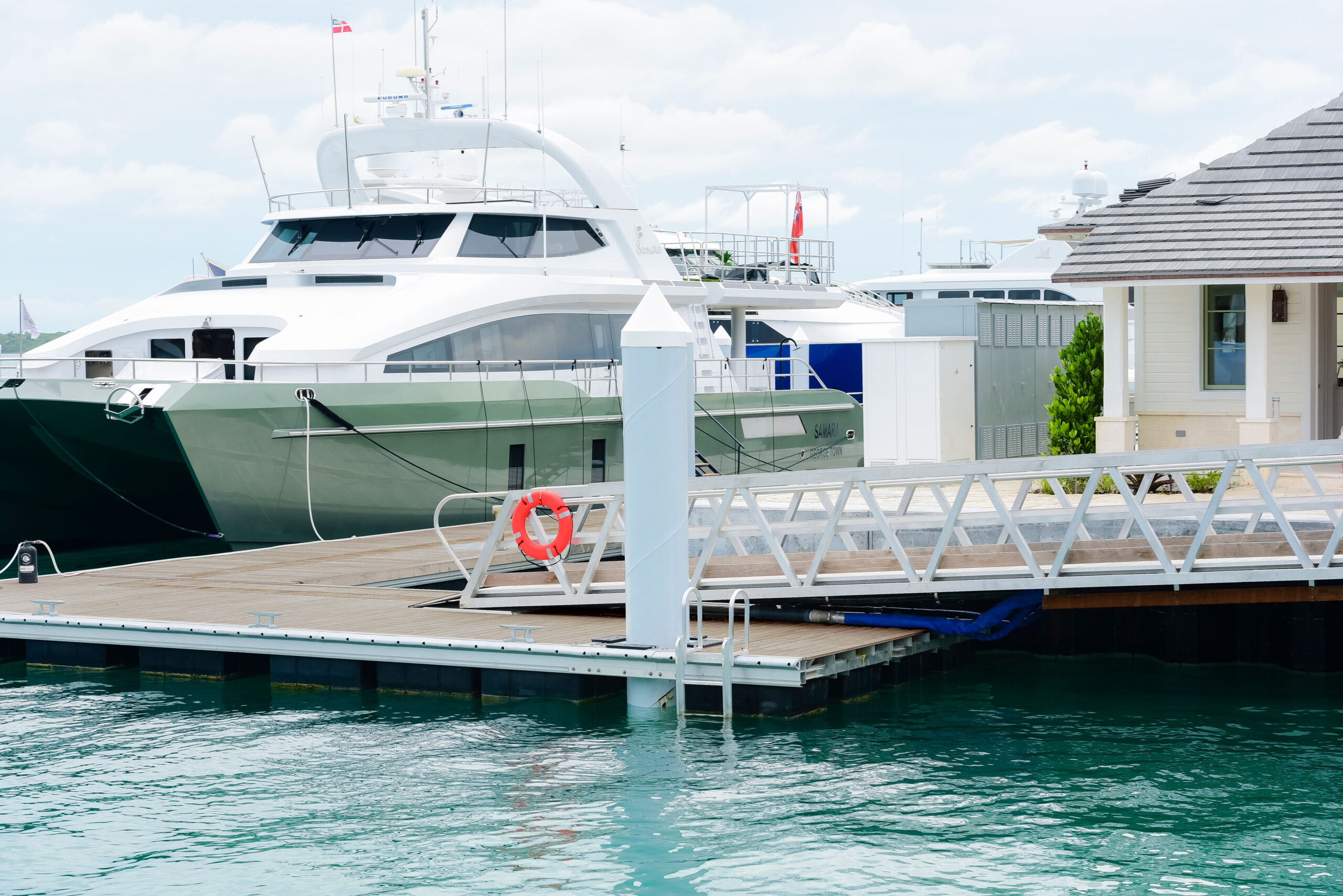 Custom aluminum gangway in the Bahamas leading to dock where yacht is moored