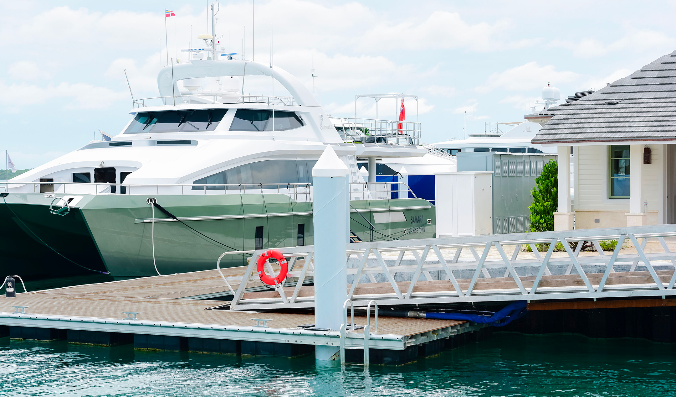 Custom aluminum gangway in the Bahamas leading to dock where yacht is moored