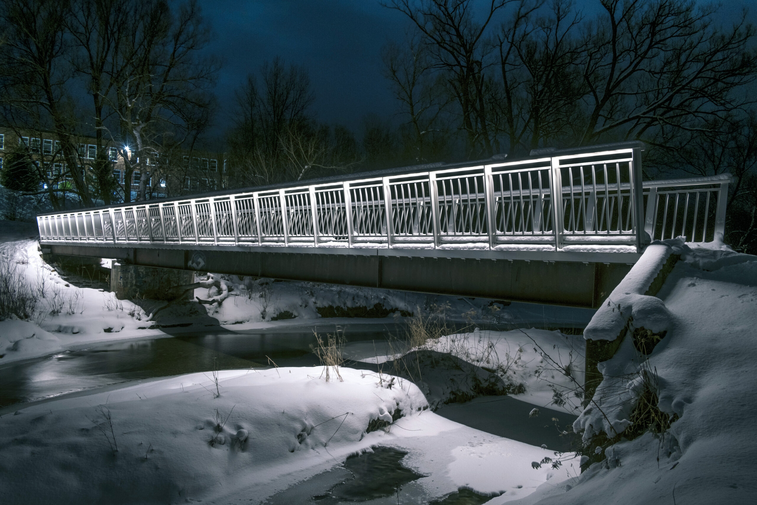 Steel bridge retrofit with GuarDECK weld-free aluminum bridge decking and illuminated guardrails