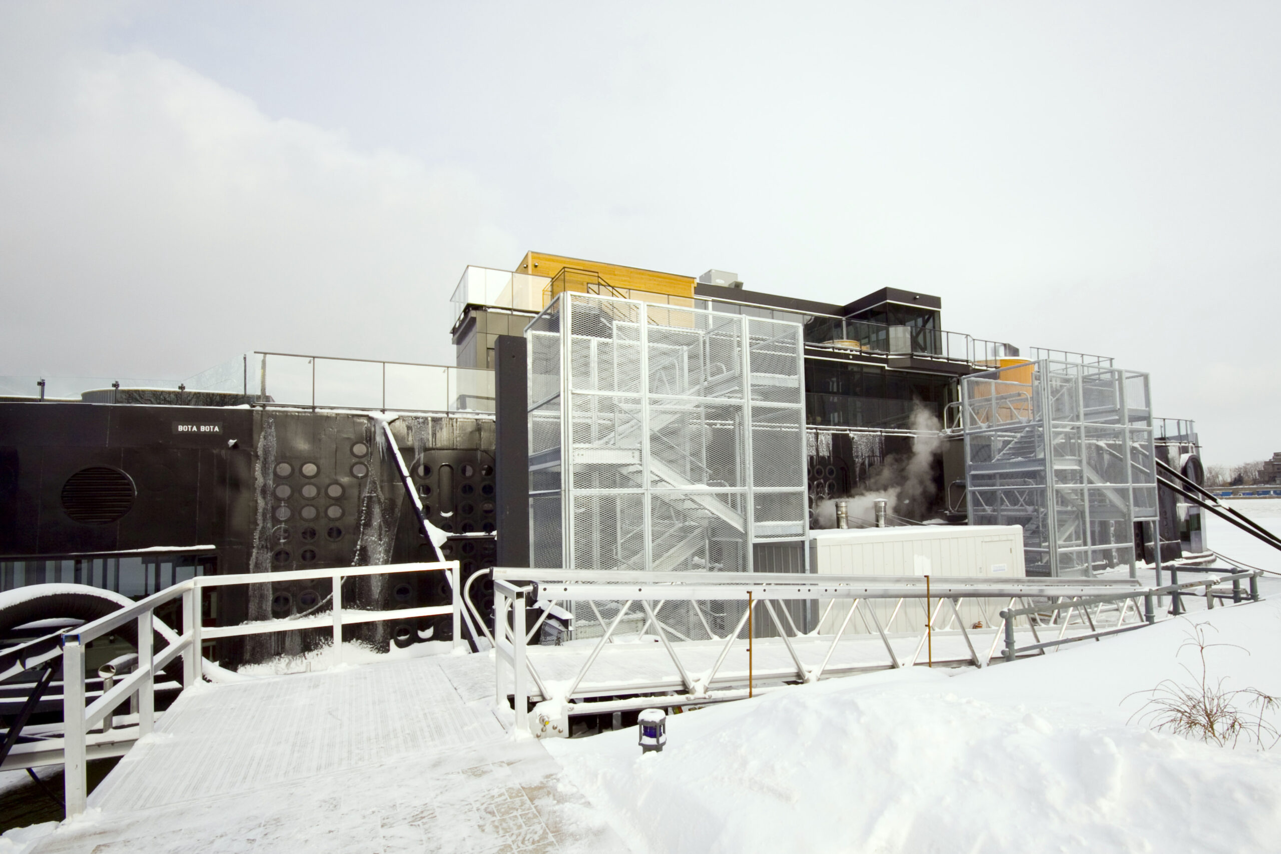 System of aluminum gangway kits and stairs leading to spa boat in winter in Montreal, Canada