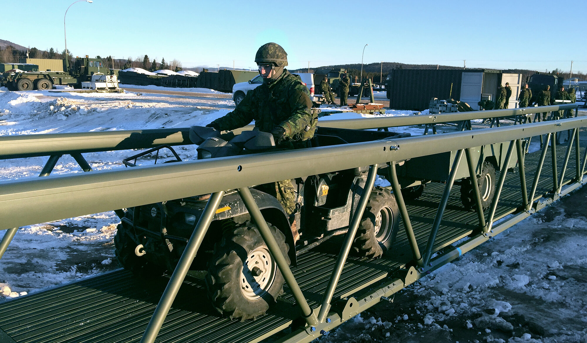 Solider on military quad with trailer crossing LVTB-1811 lightweight tactical bridge