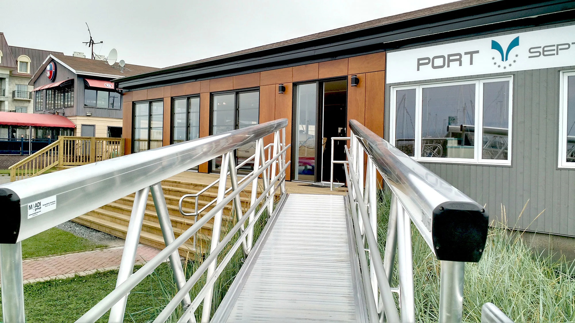 Modular MakeABridge® aluminum pedestrian bridge at the Port of Sept-Îles, Quebec, engineered by MAADI for coastal durability and easy installation