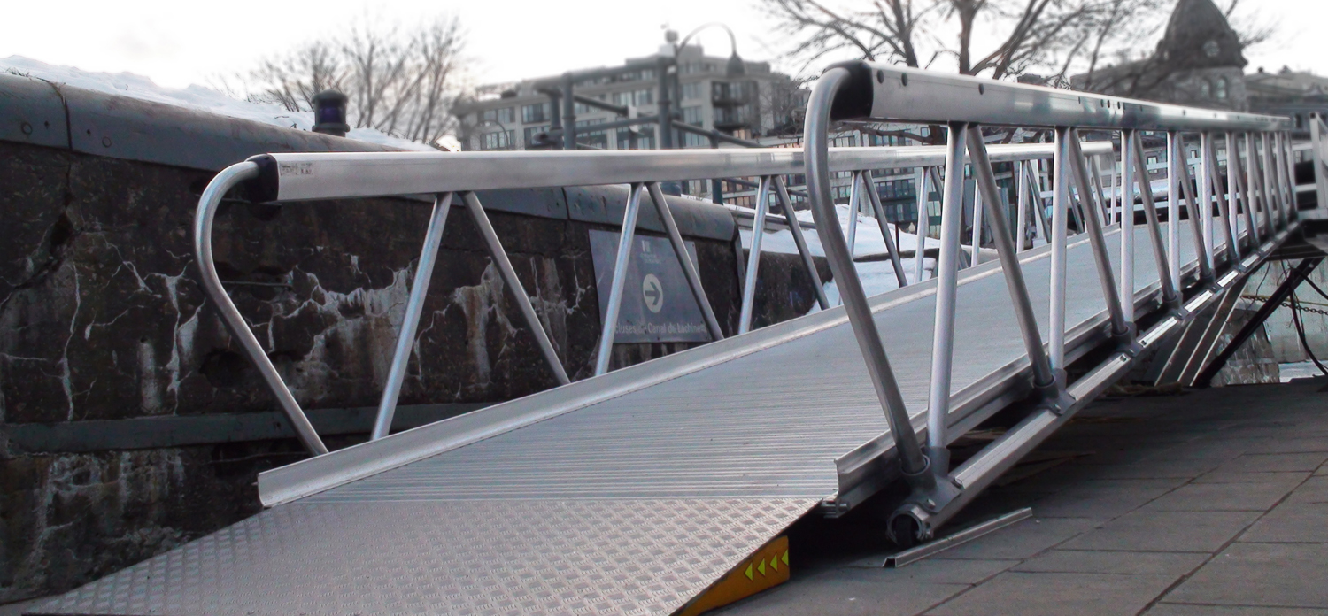 MAADI Group’s sleek modular aluminum pedestrian bridge at Bota Bota Spa in Montreal, featuring modern design and corrosion-resistant materials.
