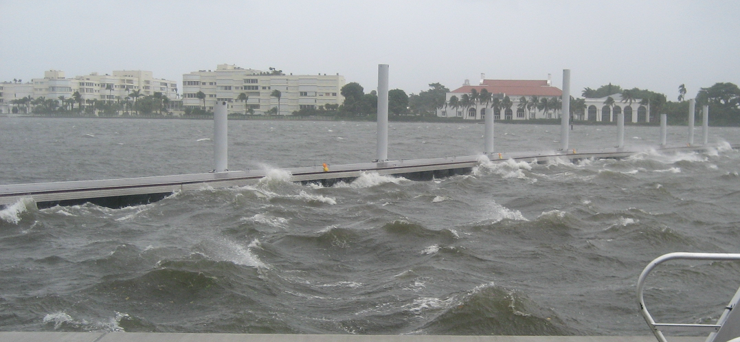 Floating dock system under wave loading conditions illustrating performance of wave attenuators in marina environment