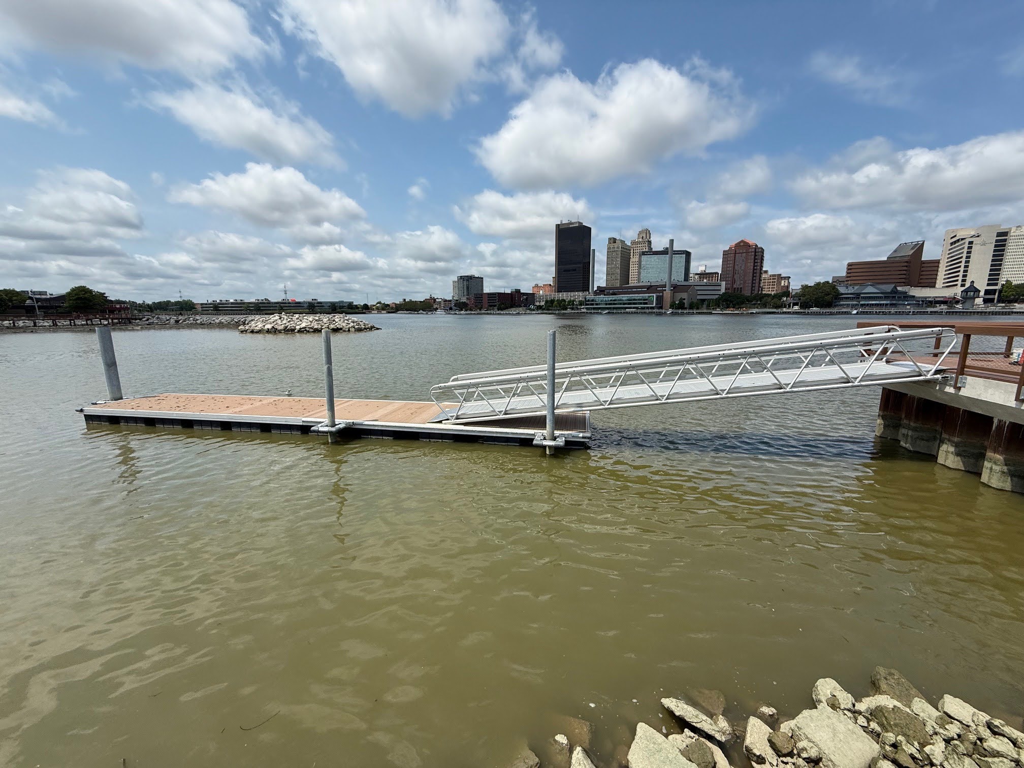 Modular aluminum gangway kit connecting a fixed shore structure to a floating dock